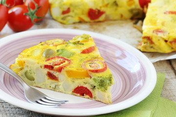 Sliced Spanish tortilla with potatoes and other vegetables