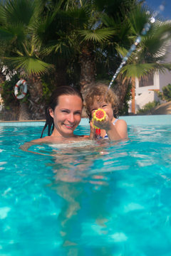 Mother and child in swimming pool