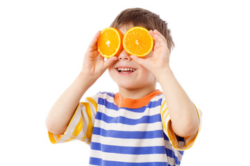 Funny boy with fruits on eyes