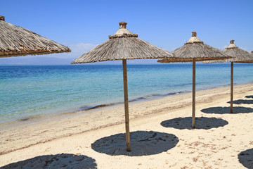 Straw umbrellas by the sea