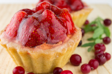 Cake with strawberries over white