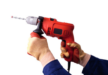 Gloved hands with electric drill