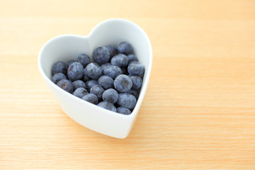 Blueberry in a heart shape bowl