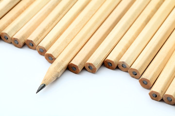 Row of unused pencil with one sharpened