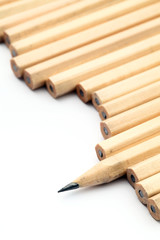 Row of unused pencil with one sharpened