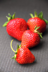 Fresh strawberry on dark grey background
