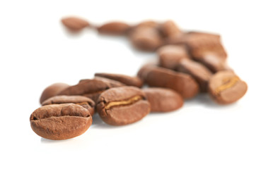 Macro of coffee beans isolated on white background