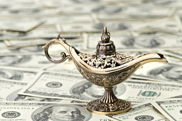 aladdin lamp on dollar background