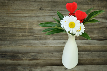 Chamomiles and two hearts