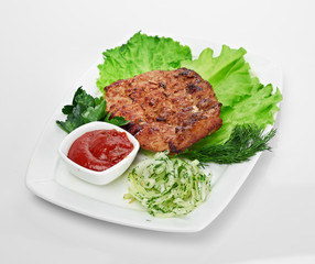 Grilled steak on a white plate