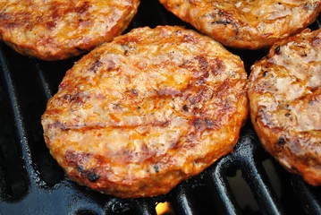 Gordijnen Spicy Sausage Patties Cooking on a Summer Grill © Bill