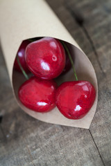 Fresh cherries on wooden background