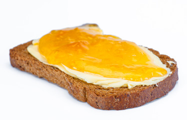 Cover toast with butter and jam isolated on white