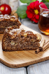 Cinnamon cake on wooden tray.