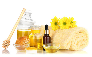 Fototapeta na wymiar Fragrant honey spa with oils and honey isolated on white