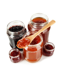 Tasty jam in banks isolated on white