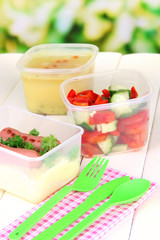 Tasty lunch in plastic containers,