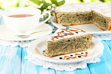 Delicious poppy seed cake with cup of tea