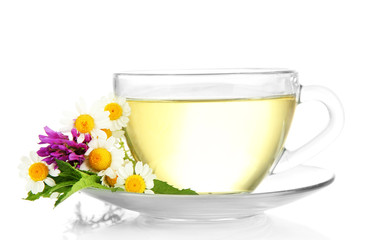 Cup of herbal tea with wild flowers and mint, isolated on white