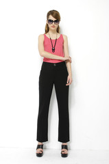 Fototapeta premium Full length Beautiful slim woman in sunglasses posing