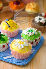 cup cakes with a lot of bread pastry background