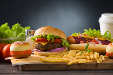 burger with fast food items and materials on the background