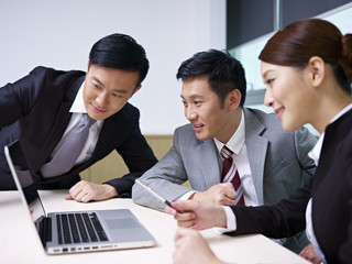 asian business team working together in office