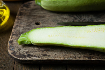 sliced ​​raw zucchini on the kitchen board