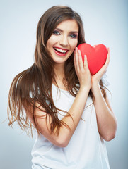 Red heart. Love symbol. Portrait of beautiful woman hold Valent