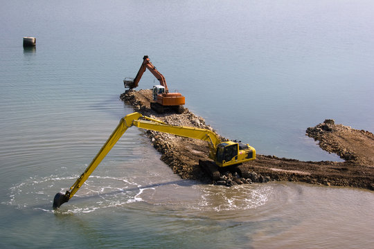 Two backhoes between islands Ugljan and Pasman in Croatia