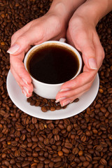 Woman holding hot cup of coffee