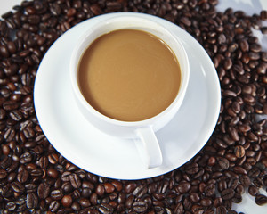 Coffee beans and coffee cup