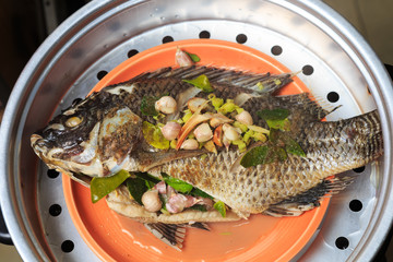 Fresh  fish with oriental ingredients ready for steaming.