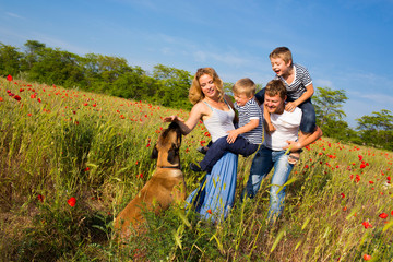 Family on the poppy meadow