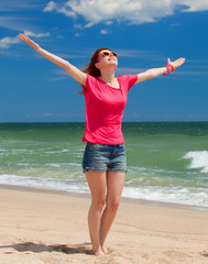 Redhead teen girl on the beach