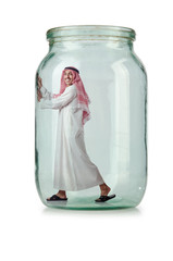 Arab businessman in glass jar