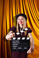Woman gangster with movie clapper