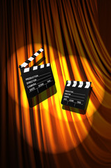 Movie clapper board against curtain
