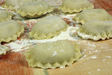 raw homemade polish pierogi  dumplings of unleavened dough