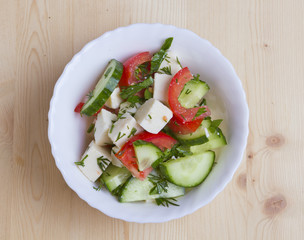 low-calorie salad with fresh vegetables and cheese