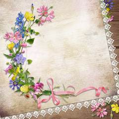 Fototapeta na wymiar Flowers on the vintage background with lace