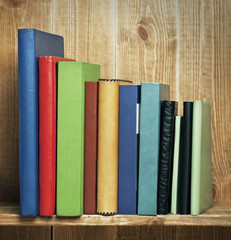 Books on the wooden shelf