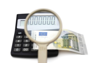 concept of accounting fraud with money,calculator,magnifier