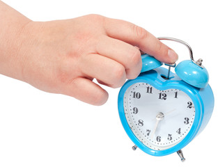 a woman hand Turning Off Alarm Clock. (with clipping paths)
