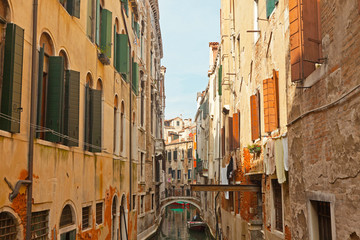 Fototapeta na wymiar The canals of Venice with colorful houses. Italy.