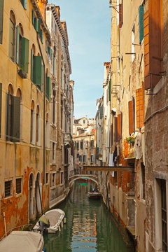 The canals of Venice with colorful houses. Italy.
