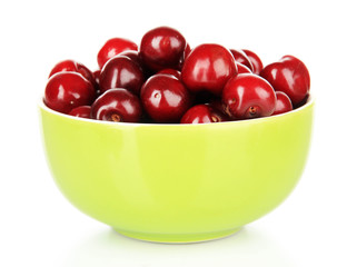 Cherry berries in bowl isolated on white