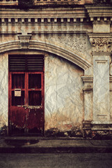 Fototapeta na wymiar Old red door on old wall ,Vintage style