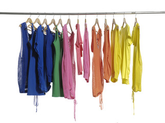 fashion female clothing hanging on hangers