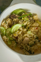 Fried rice with pork on white dish